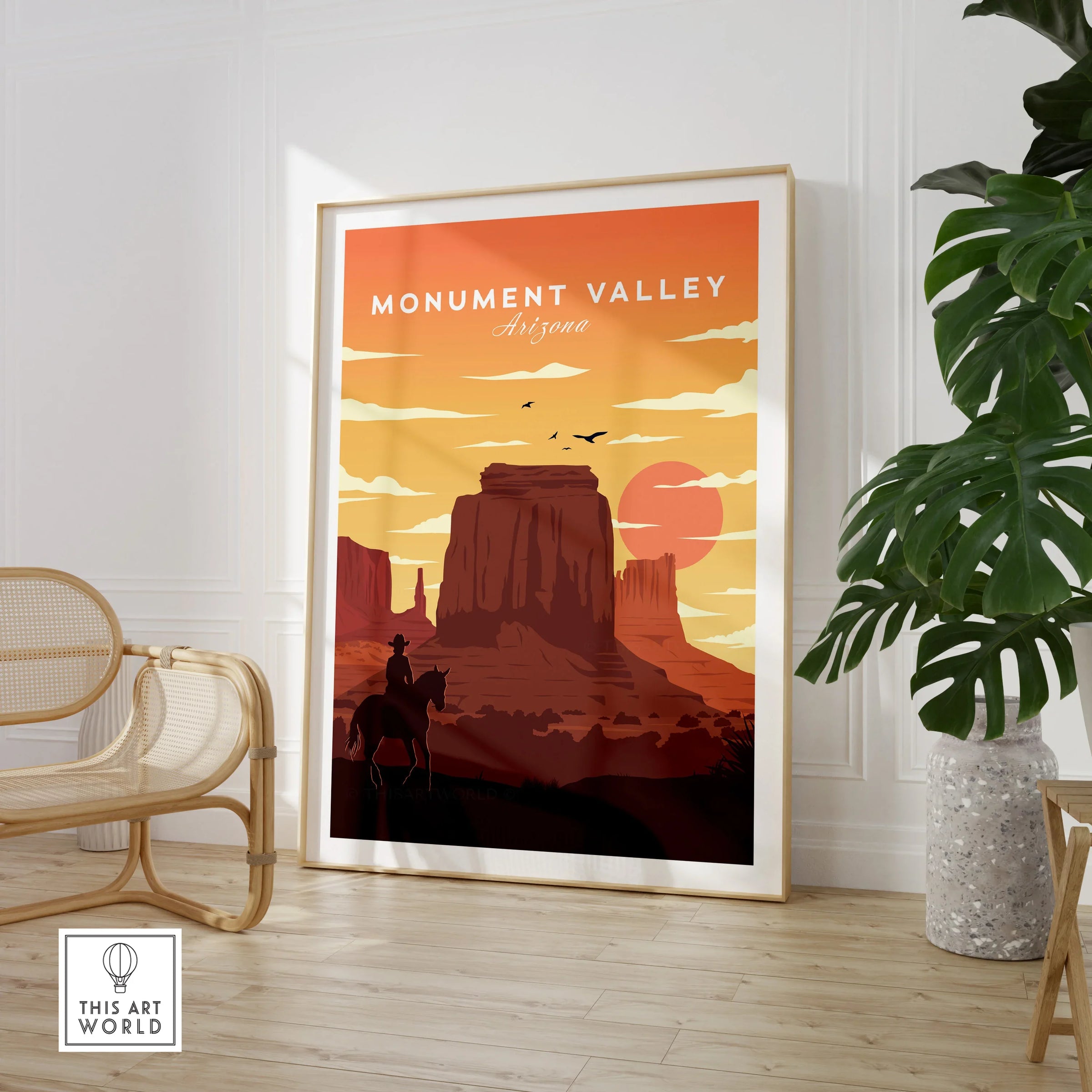 Monument Valley Arizona framed travel poster in modern room with chair and plant