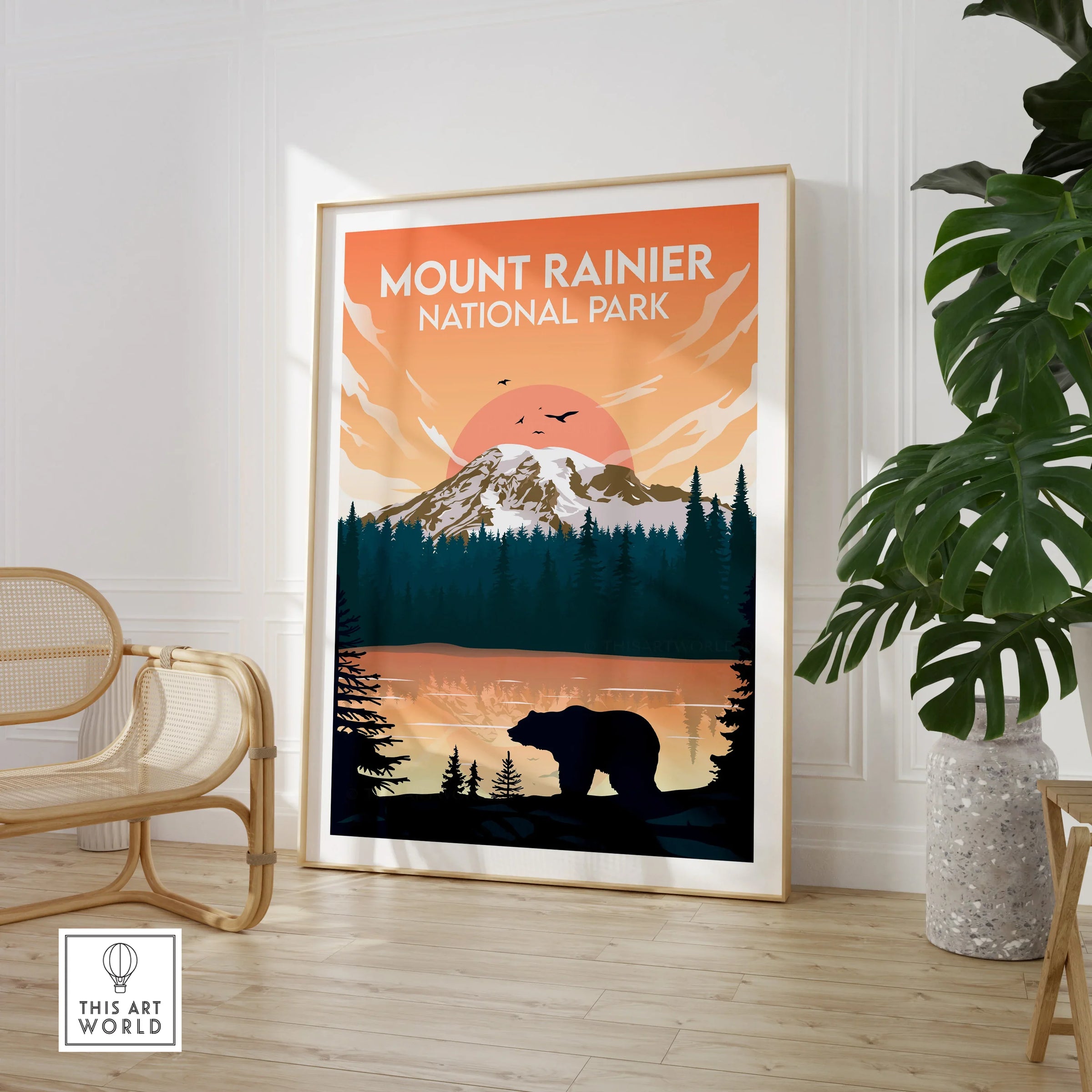 Framed Mount Rainier National Park print in modern room with chair and plant