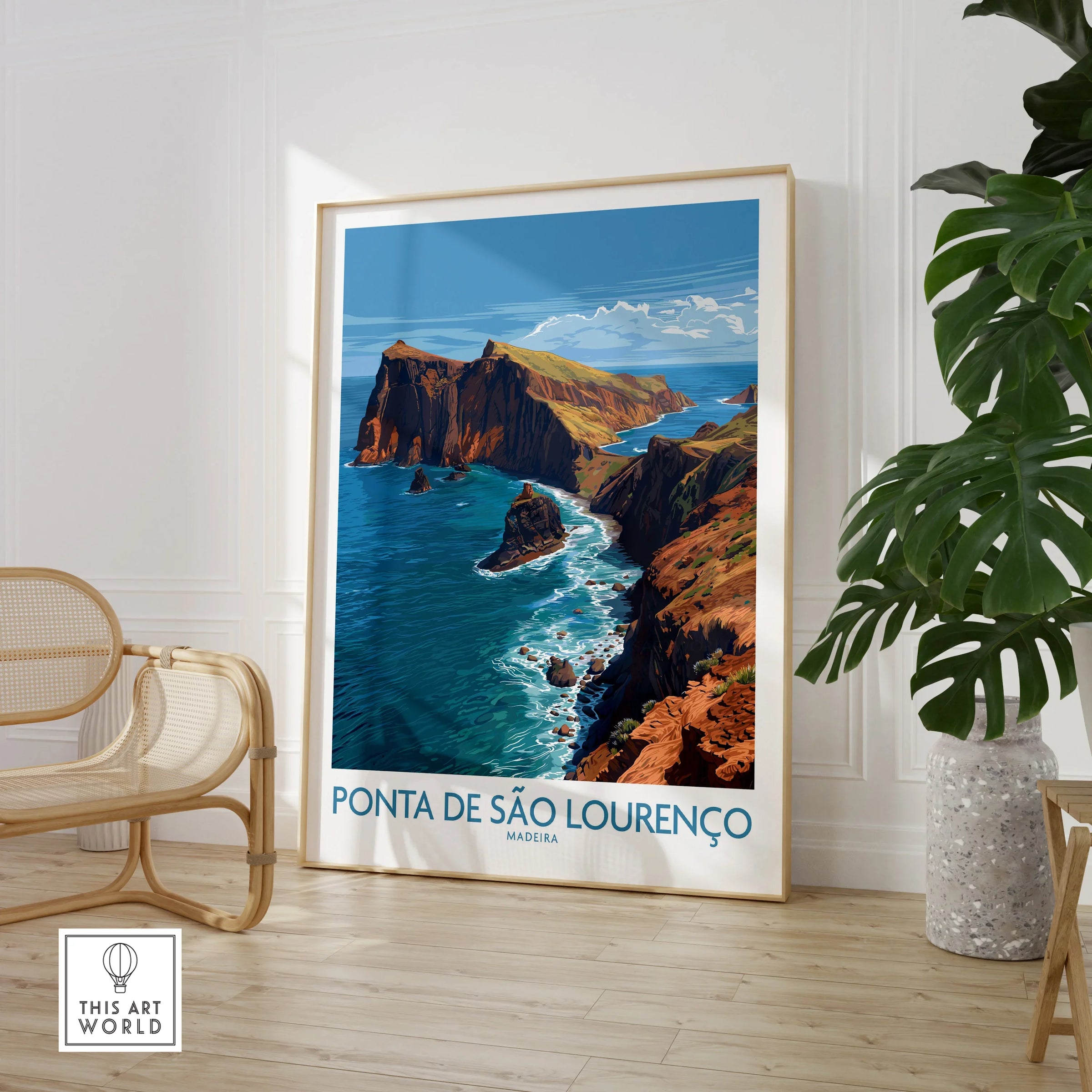 Framed Ponta de São Lourenço Madeira travel poster in a modern room with chair and plant