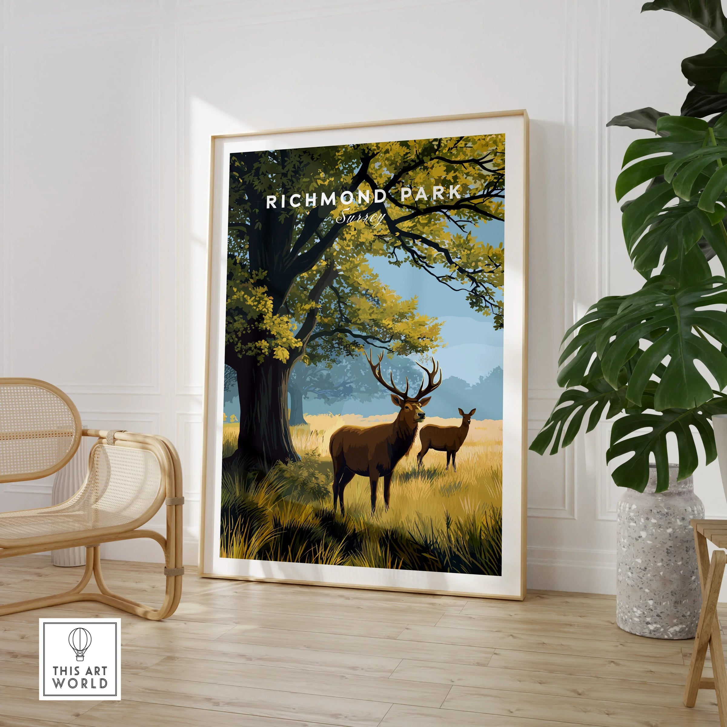 Richmond Park art print with deer in nature, displayed in modern room with plant and chair