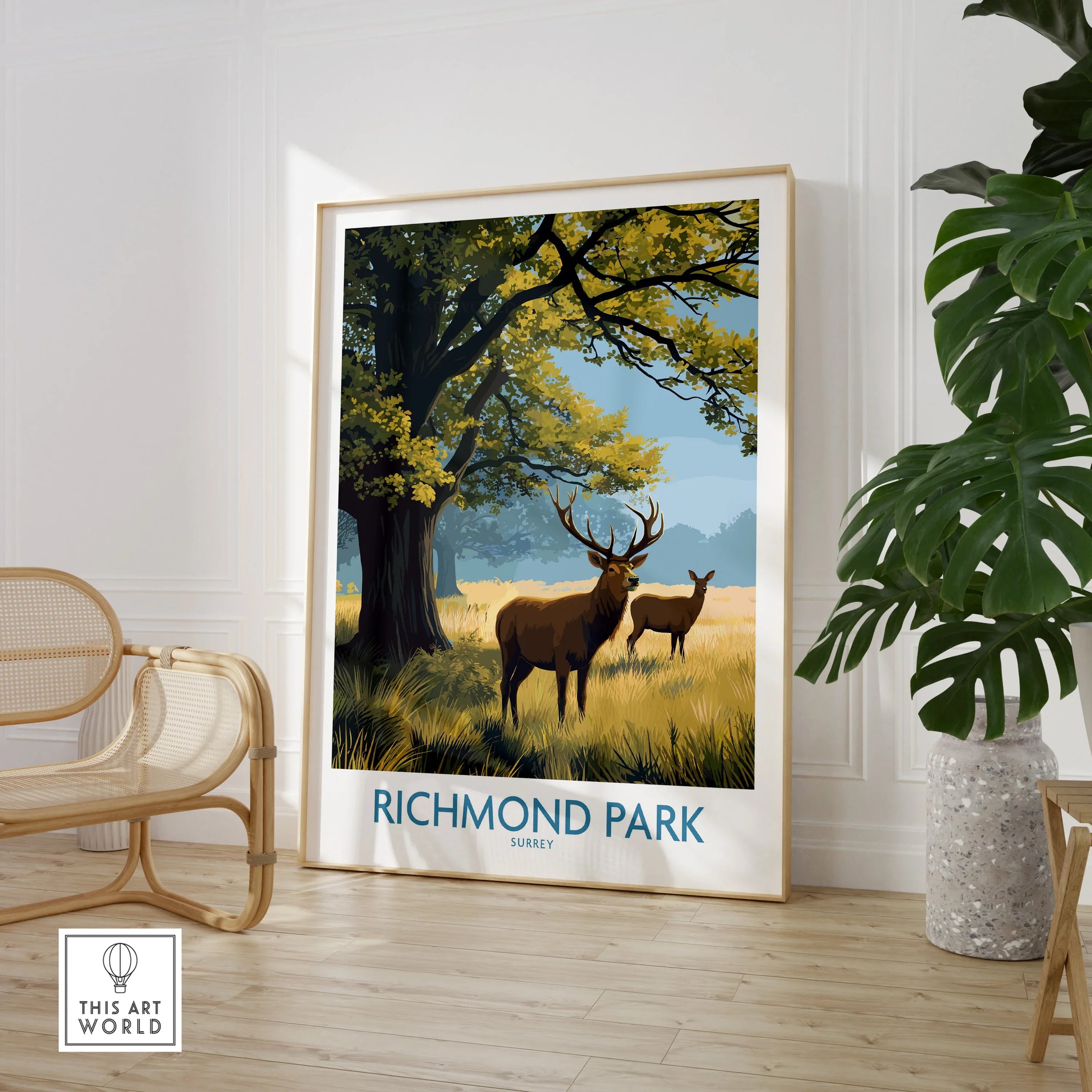Framed Richmond Park travel poster with deer, styled in modern home decor with plant and chair