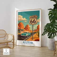Framed Route 66 travel poster on floor, mid-century car, desert, modern home decor setting