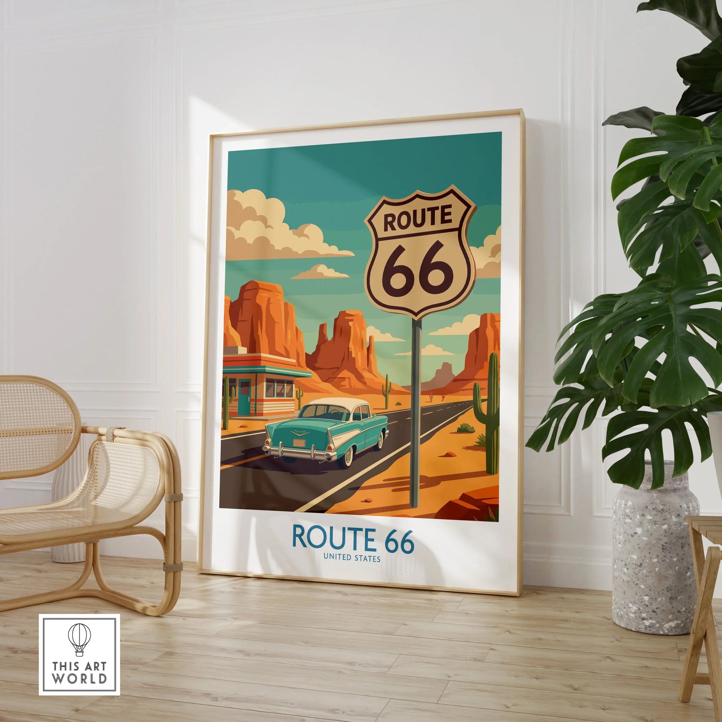 Framed Route 66 travel poster on floor, mid-century car, desert, modern home decor setting