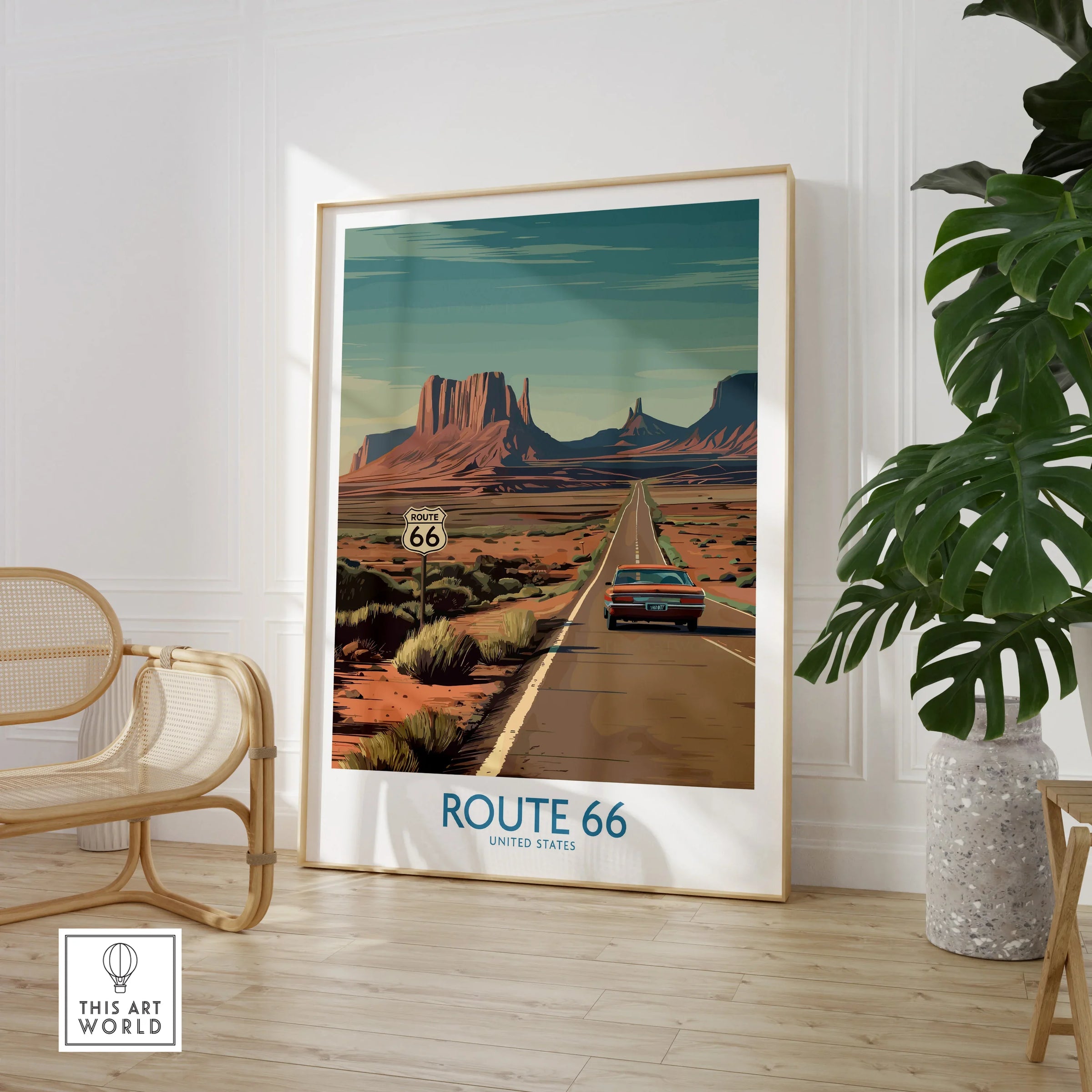 Framed Route 66 travel poster art in modern room with chair and plant, desert landscape