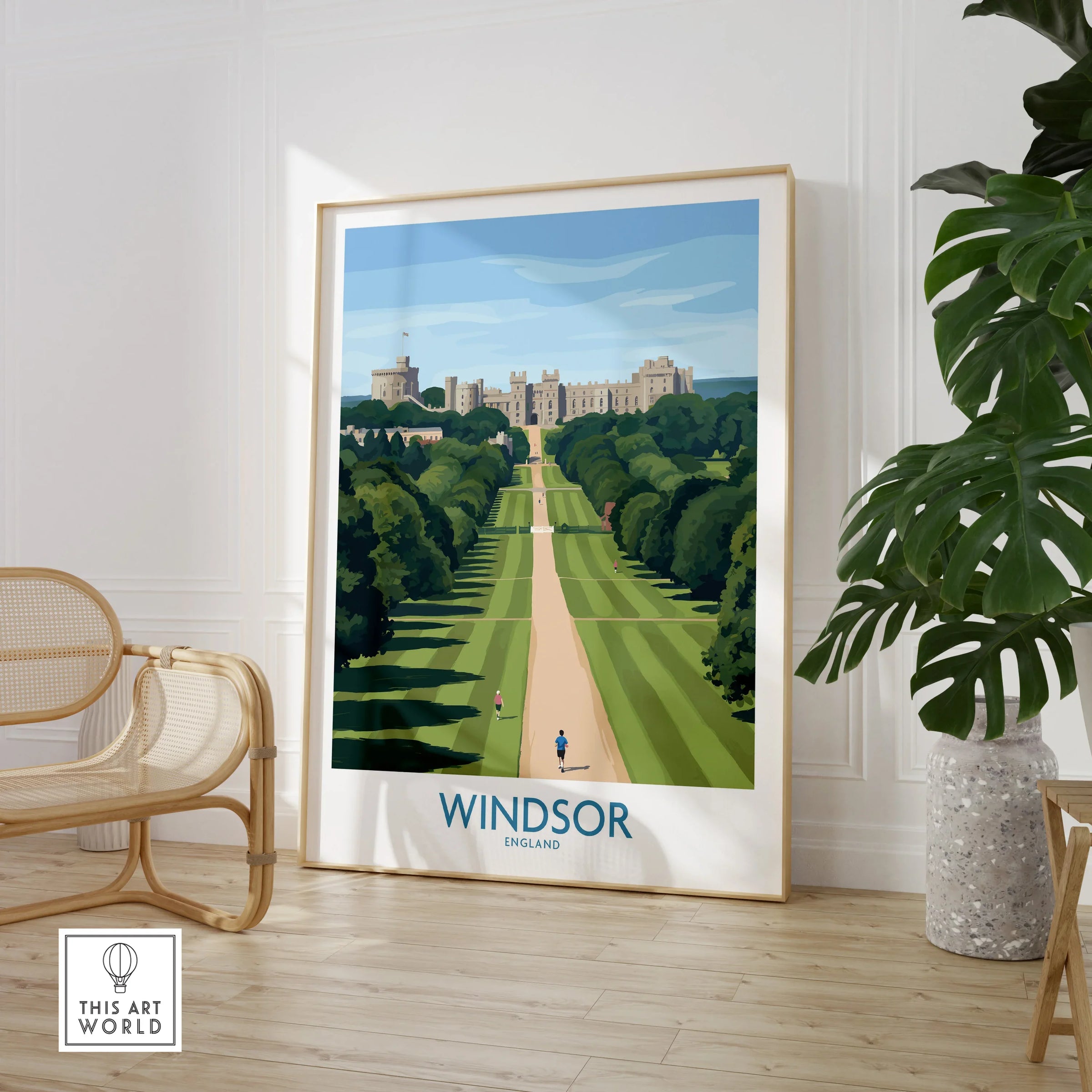 Framed Windsor travel poster print in modern room with wooden chair and green plant