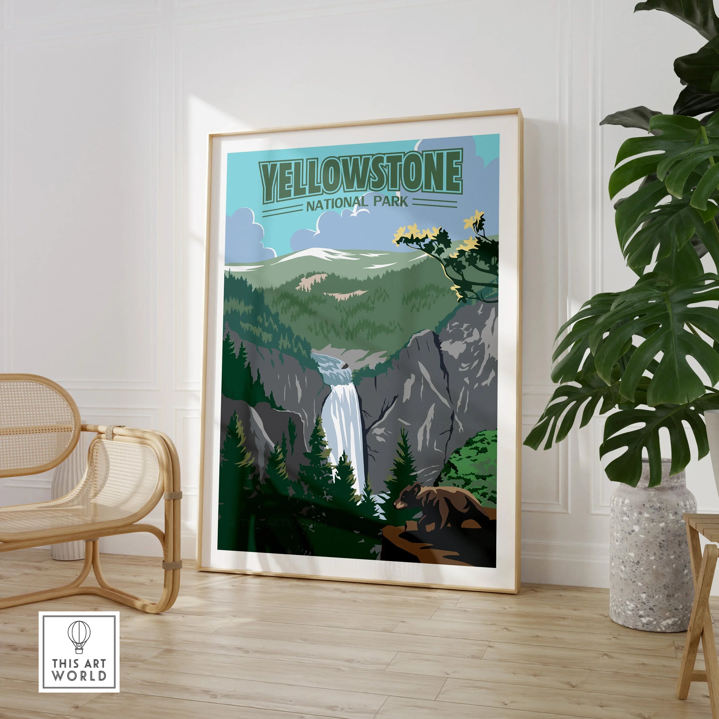 Yellowstone National Park framed print with waterfall, displayed in modern room with chair and plant
