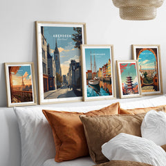 Framed travel posters of Paris, Aberdeen, Copenhagen, Tokyo, and Barcelona for wall art decor
