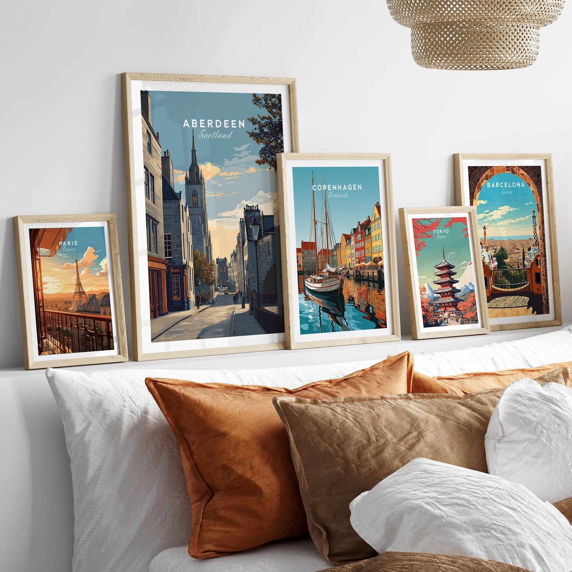 Framed travel posters of Paris, Aberdeen, Copenhagen, Tokyo, and Barcelona for wall art decor
