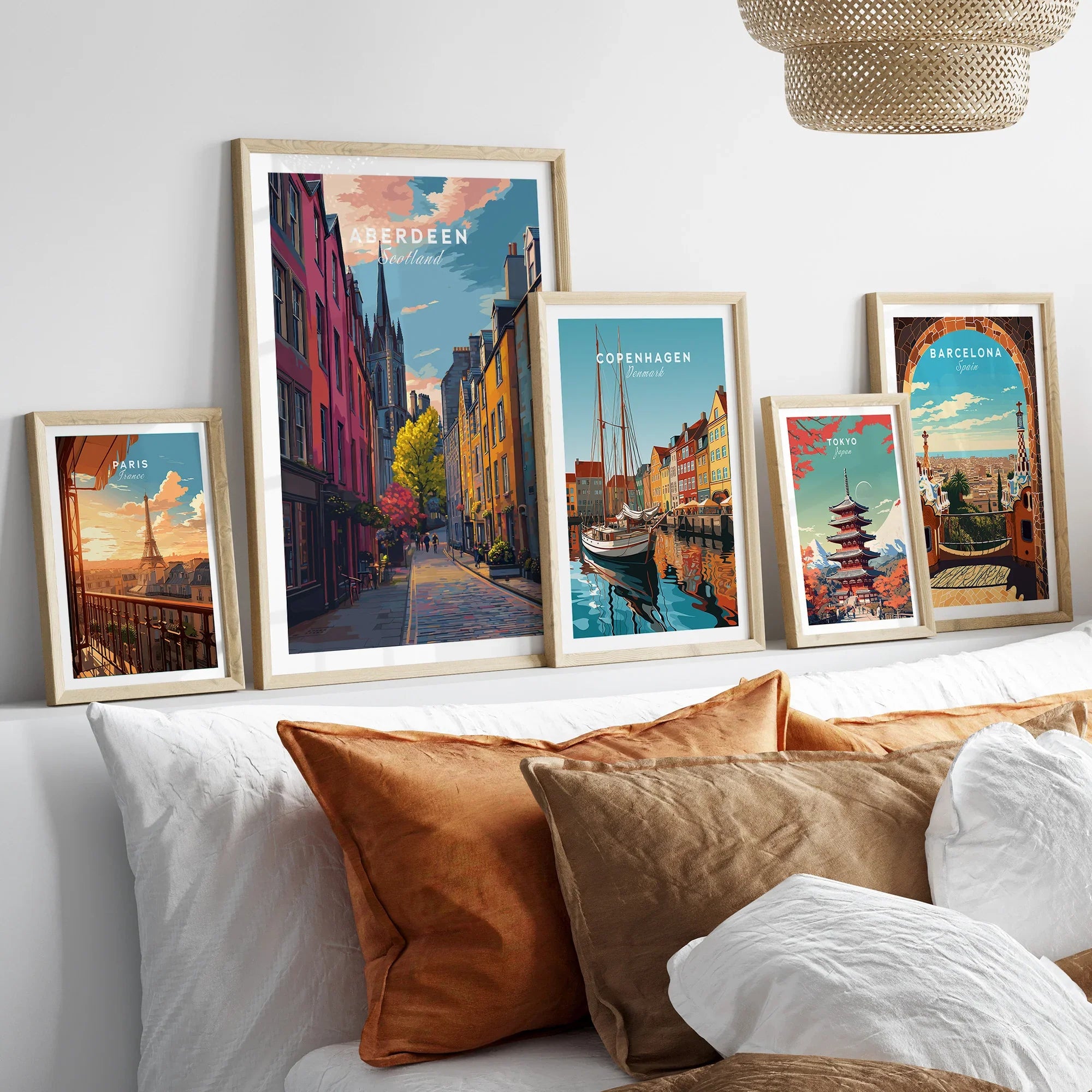 Framed travel posters of Paris, Aberdeen, Copenhagen, Tokyo, and Barcelona for wall art decor