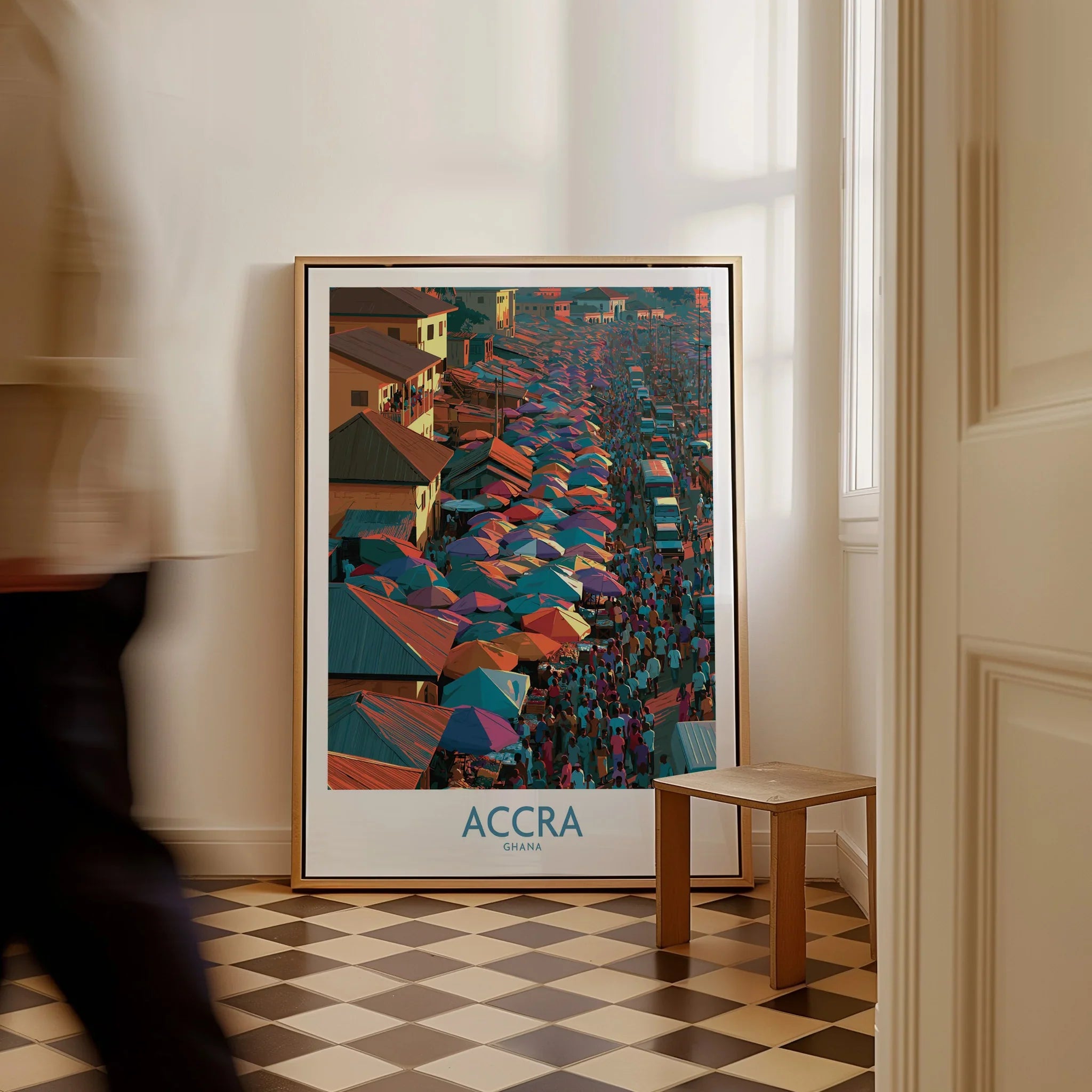 Accra Ghana framed canvas wall art on the floor with a man walking past