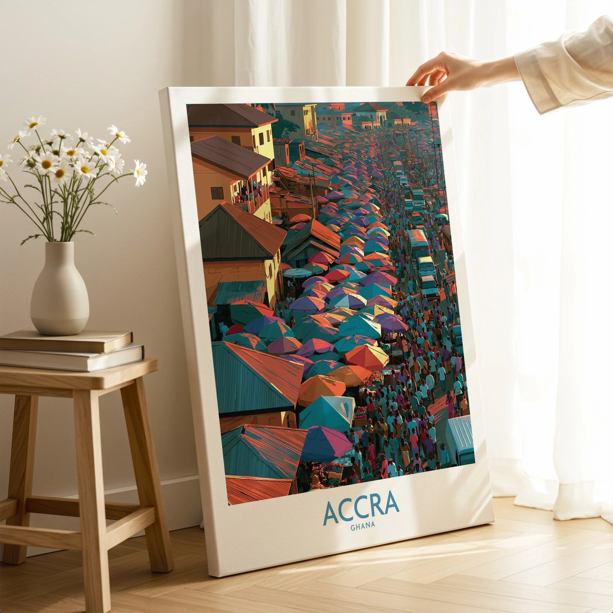 Accra Ghana canvas print with mirror edge held by hand in a room setting