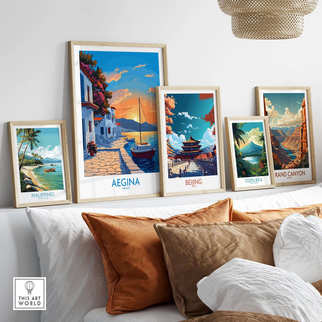 Aegina Greece travel poster displayed among other travel posters on a stylish couch in a modern interior.