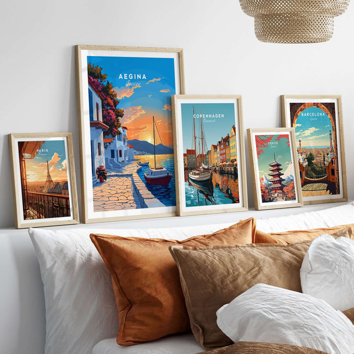 Aegina Greece travel print displayed among other city prints in a cozy home setting with decorative pillows.