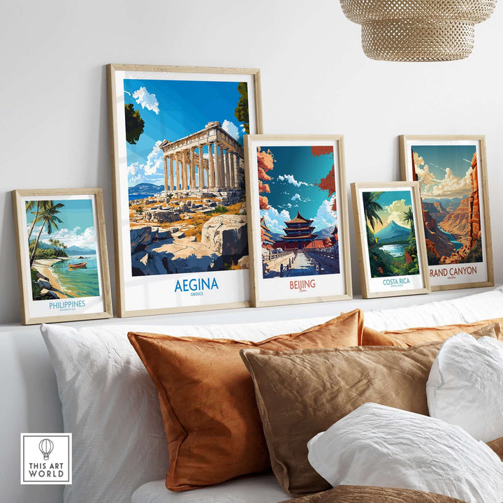 Aegina poster featuring the temple of Aphaia, displayed among travel-themed art prints on a stylish sofa.