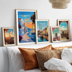 Aegina Travel Print showcased among travel prints of Copenhagen and Barcelona on a stylish couch.