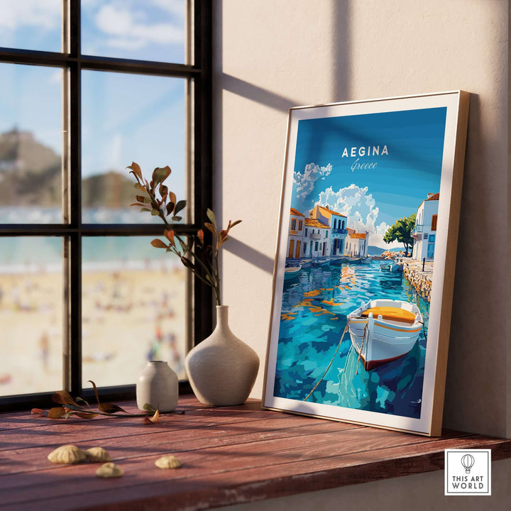 Framed Aegina wall art showcasing a beautiful Greek island scene with a boat and seaside village.