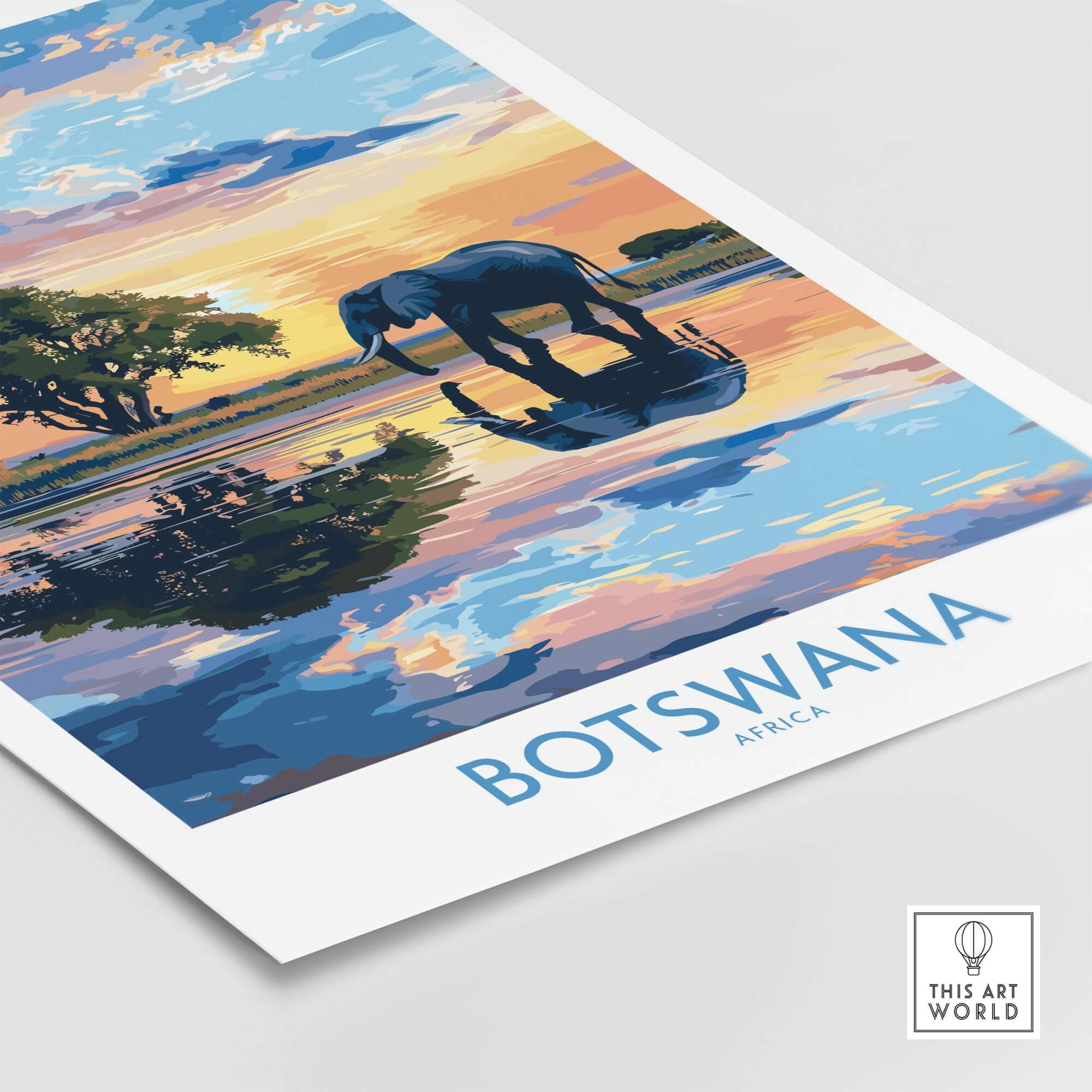 African Elephant in Botswana - Golden Hour Sunset Fine Art Print showcases a majestic elephant by a reflective water surface at sunset.