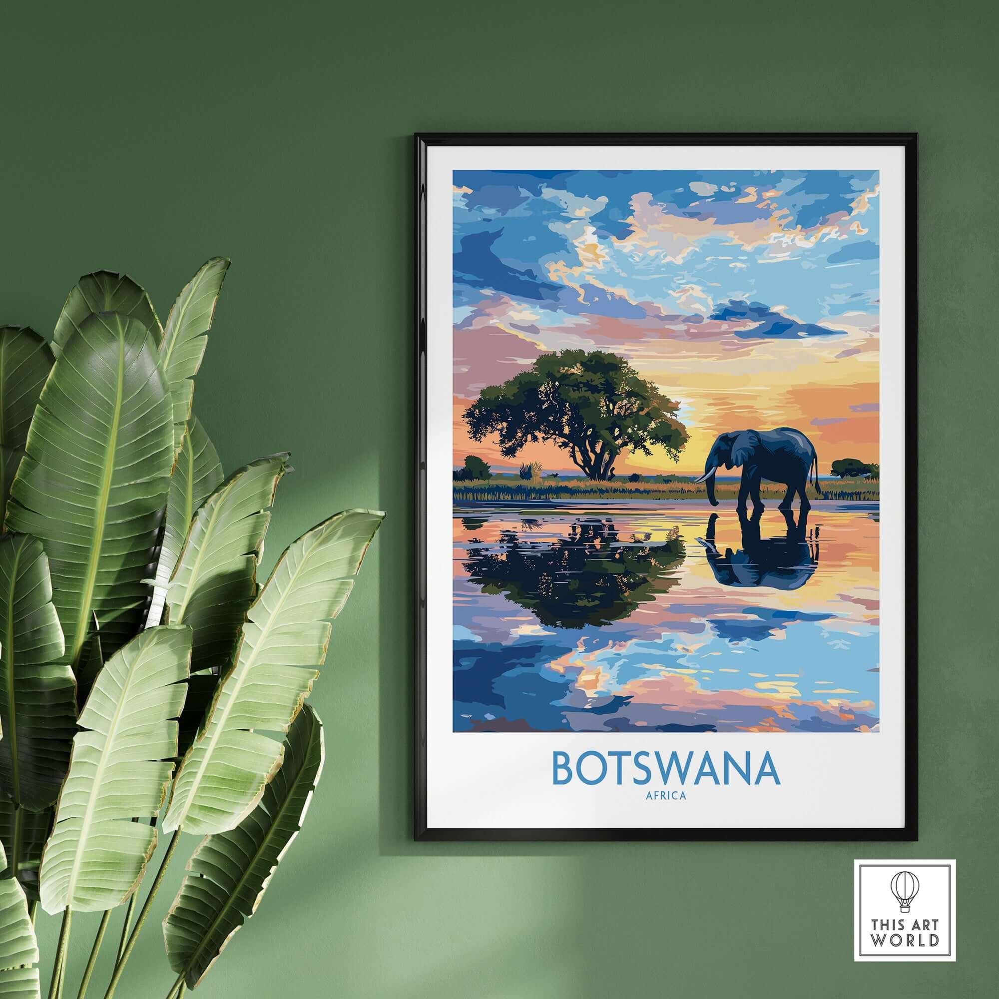 African Elephant in Botswana - Golden Hour Sunset Fine Art Print displayed in a modern frame against a green wall.