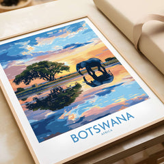 African Elephant in Botswana - Golden Hour Sunset Fine Art Print displayed in a frame on a table.