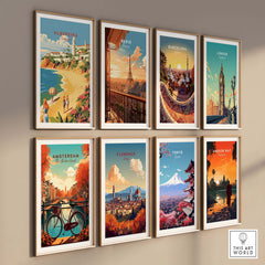 Stylish wall display of travel posters featuring popular cities including Albufeira, Paris, Barcelona, and London.