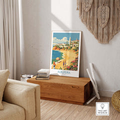 Albufeira Portugal wall art poster displayed in a cozy living room, highlighting Algarve's scenic beach and vibrant colors.