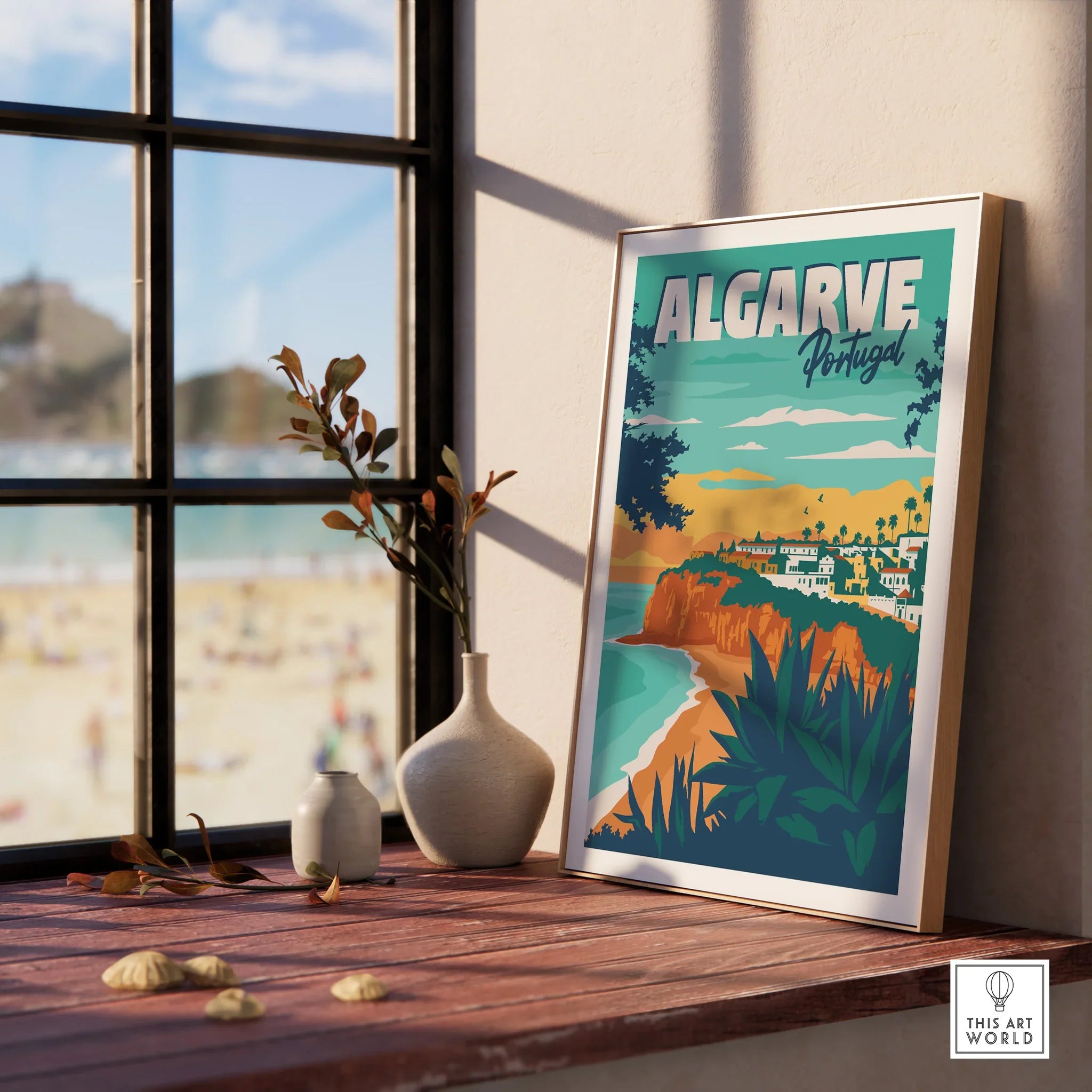 Algarve Portugal travel poster with coastal cliffs, beach, and village, framed on windowsill for home decor