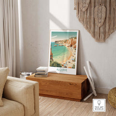 Algarve wall art print showcased in a cozy living room, featuring Portugal's beautiful beach scene with golden sands and blue waters.