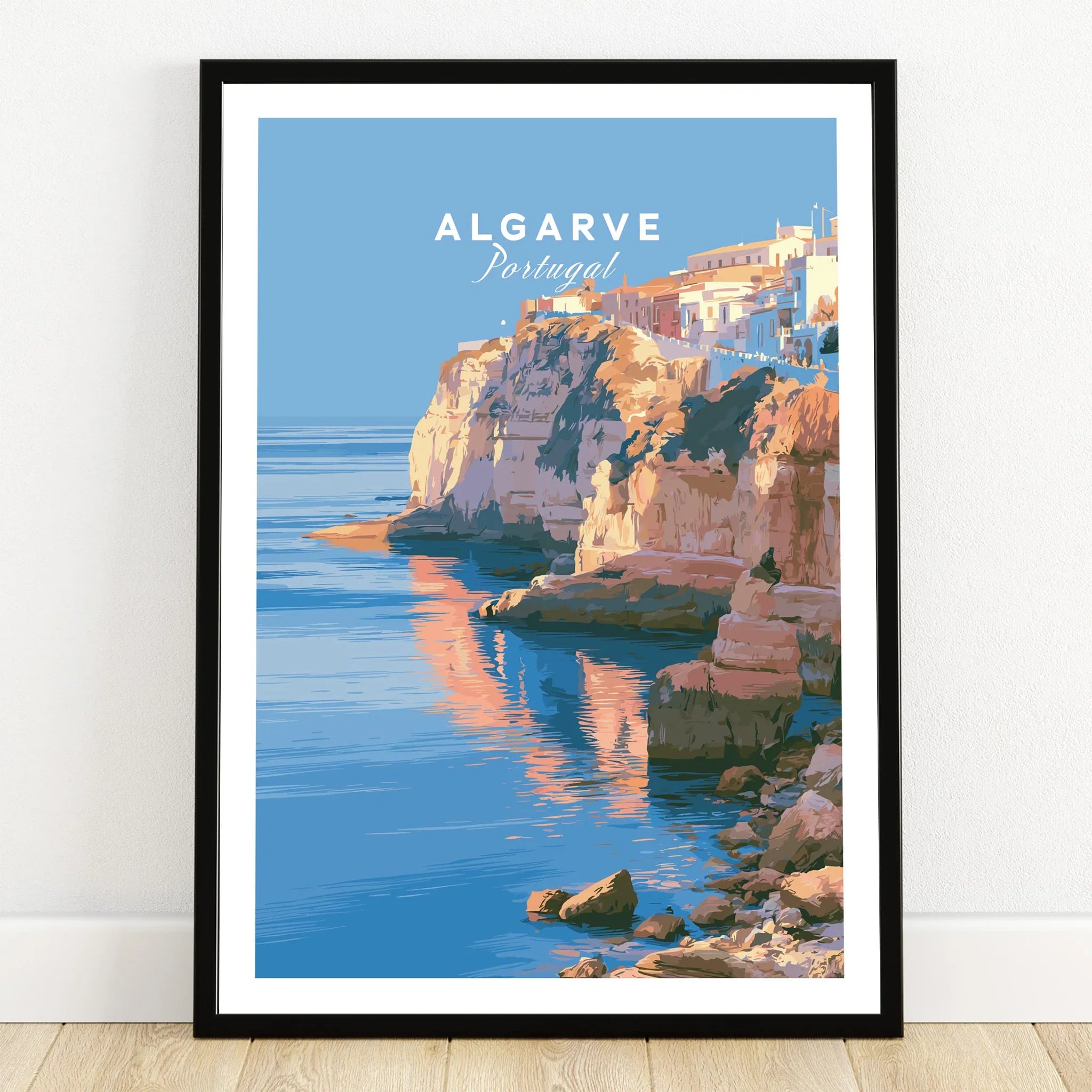 Algarve Portugal Coastal Cliffs Travel Poster — art print in black frame on wooden floor