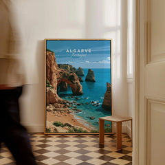 Algarve Portugal Coast Travel Poster — framed canvas on floor man walking past