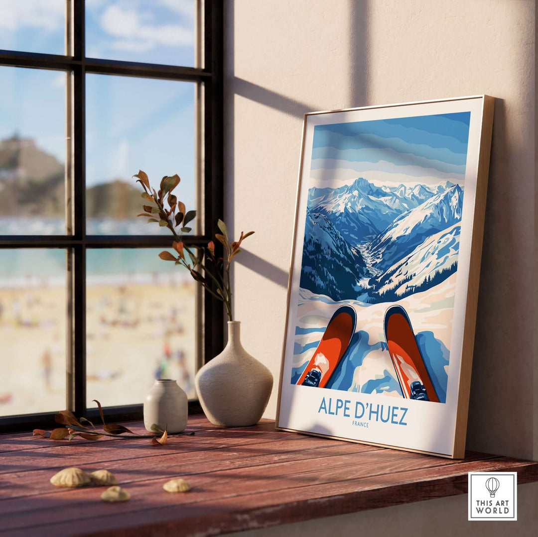 Alpe d'Huez winter sports art print displayed in a bright room with mountains and skis, capturing the essence of the French resort.