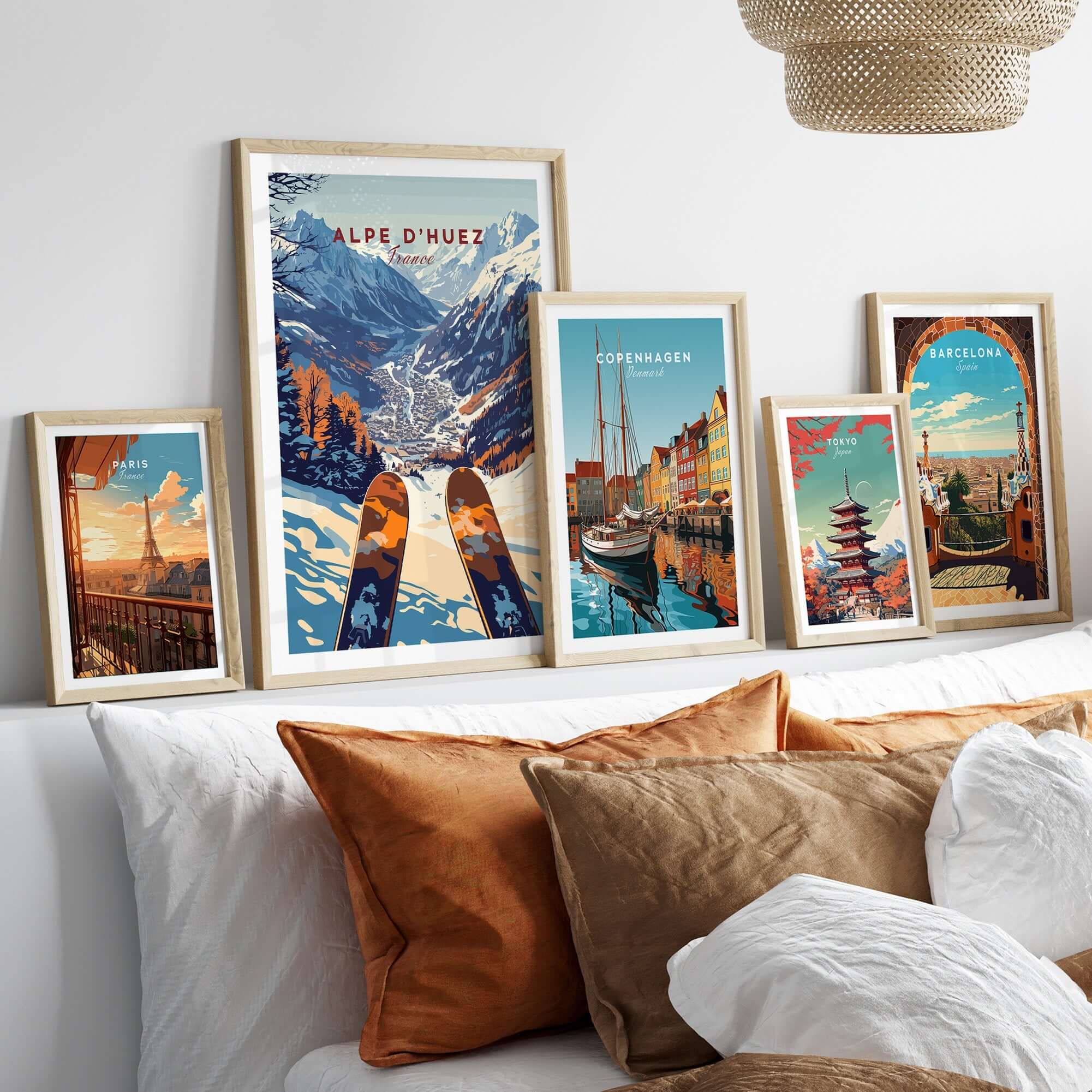 Alpe d'Huez Ski Print framed among cityscape prints on a cozy sofa, showcasing ski art for home decor enthusiasts.