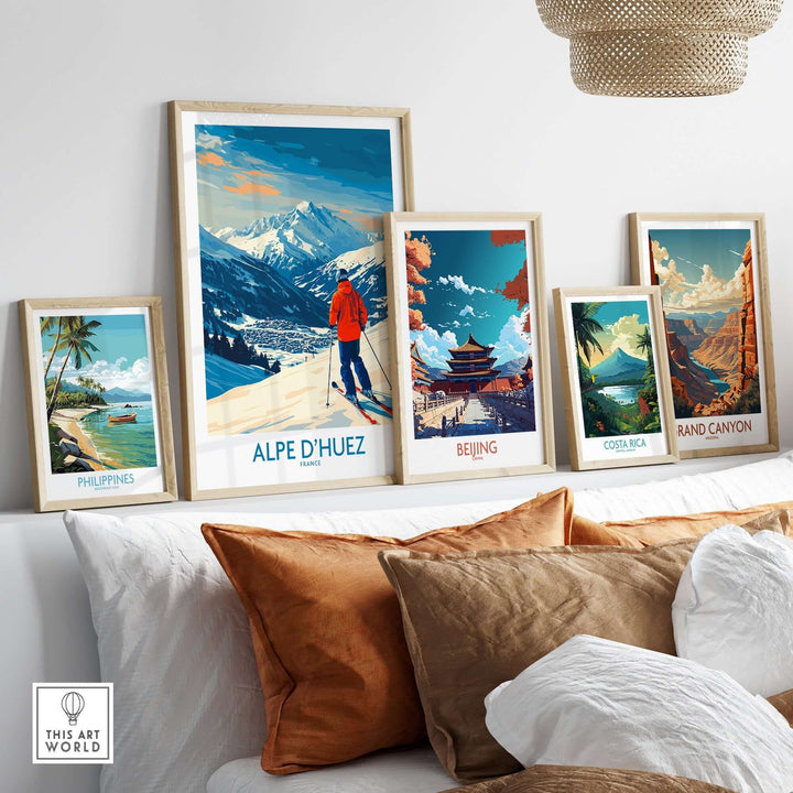 Alpe d'Huez Wall Art Ski Poster among framed travel posters in a stylish home decor setting.