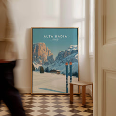 Alta Badia Italy Ski Resort Print - Dolomites Skiing Poster displayed in a stylish interior with snowy mountains background.