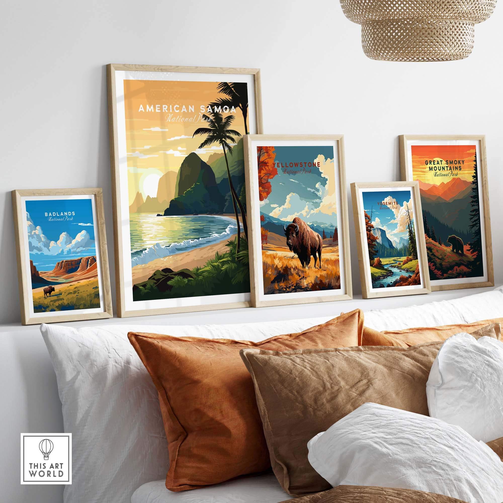 Framed travel posters of American Samoa, Yellowstone, Yosemite, Badlands, and Great Smoky Mountains National Parks displayed above a modern sofa with brown and white pillows.