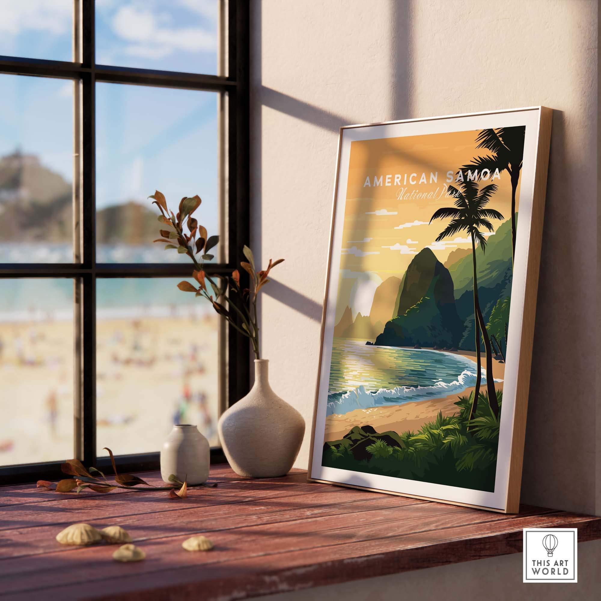 American Samoa travel poster print with tropical beach, palm trees, and ocean, displayed on a windowsill.