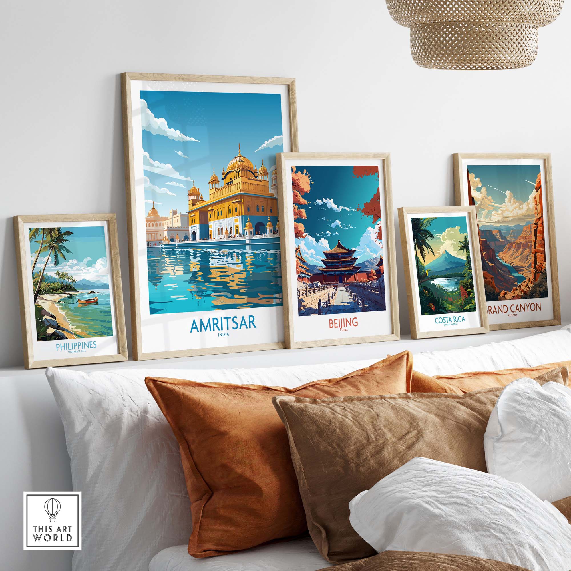 Gallery display of travel posters featuring Amritsar, Beijing, Philippines, Costa Rica, and the Grand Canyon on a stylish wall.