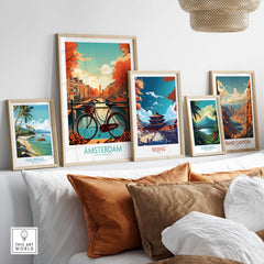 Framed Amsterdam wall art print among other destination artworks, showcasing a vibrant city scene with a bicycle.