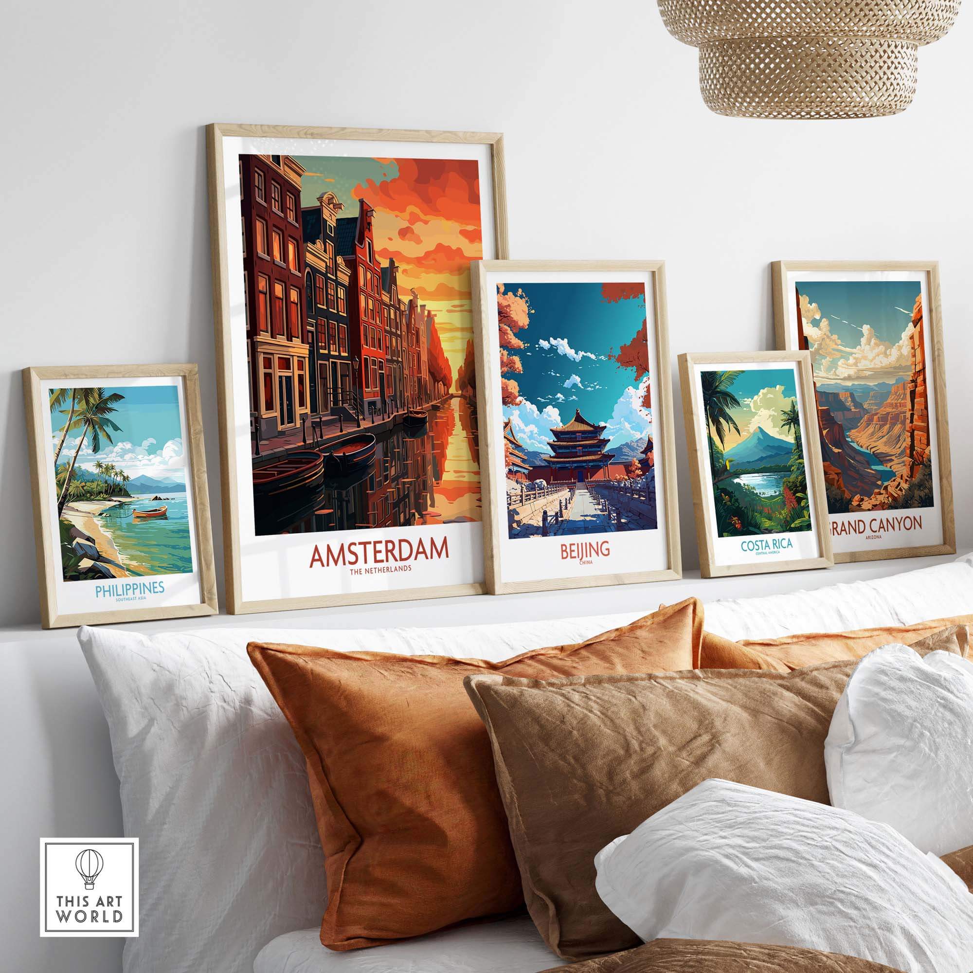 Collection of travel wall art featuring Amsterdam, Beijing, Costa Rica, and the Grand Canyon in a stylish living room setting.