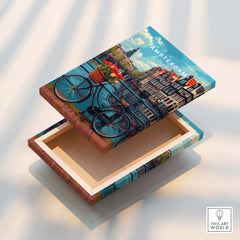 Poster of Amsterdam design featuring a scenic view with bikes and tulips in a decorative wooden box.