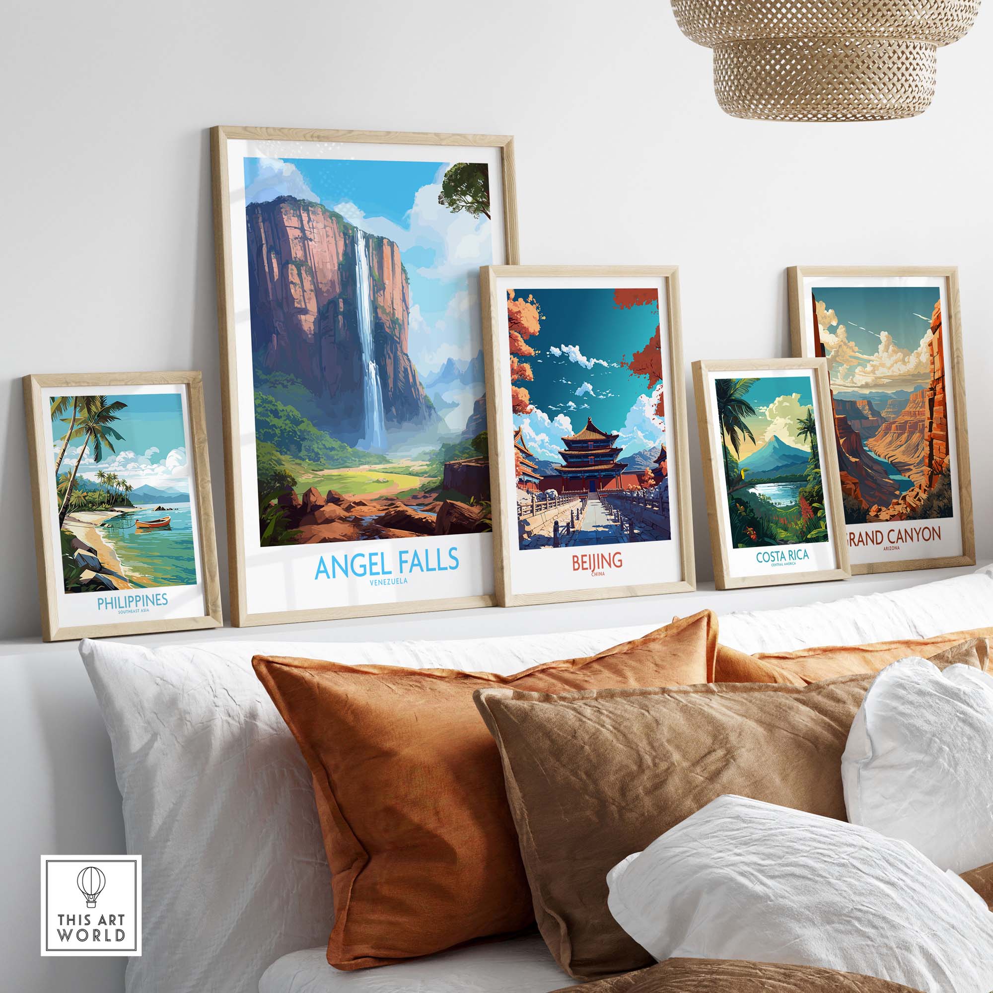 Framed Angel Falls wall art alongside travel posters of Beijing, Costa Rica, and the Philippines on a cozy sofa.