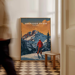 Arapahoe Basin Travel Poster - Colorado showcasing a skier against stunning mountain scenery.