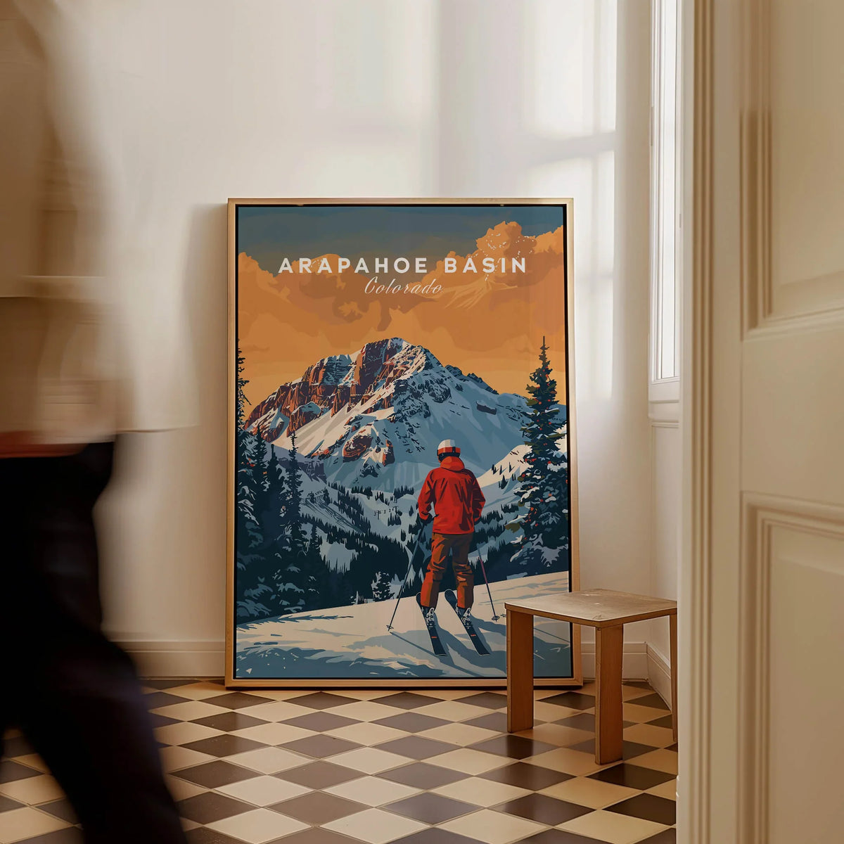 Arapahoe Basin Colorado art print featuring skier and snowy mountain landscape, leaning in hallway