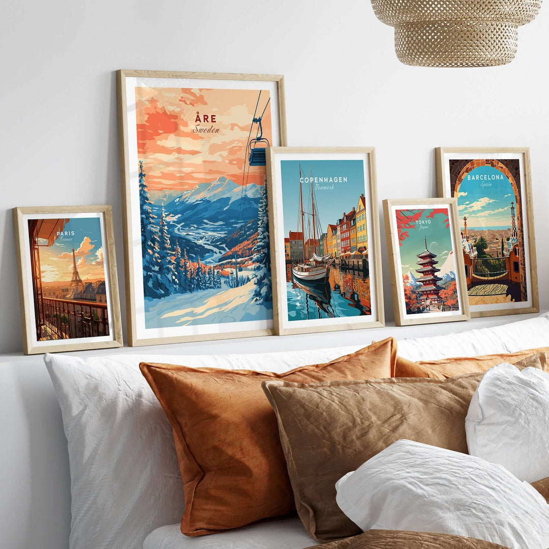 Beautiful Åre Sweden wall art ski print displayed among other cityscape prints on a cozy couch setting.