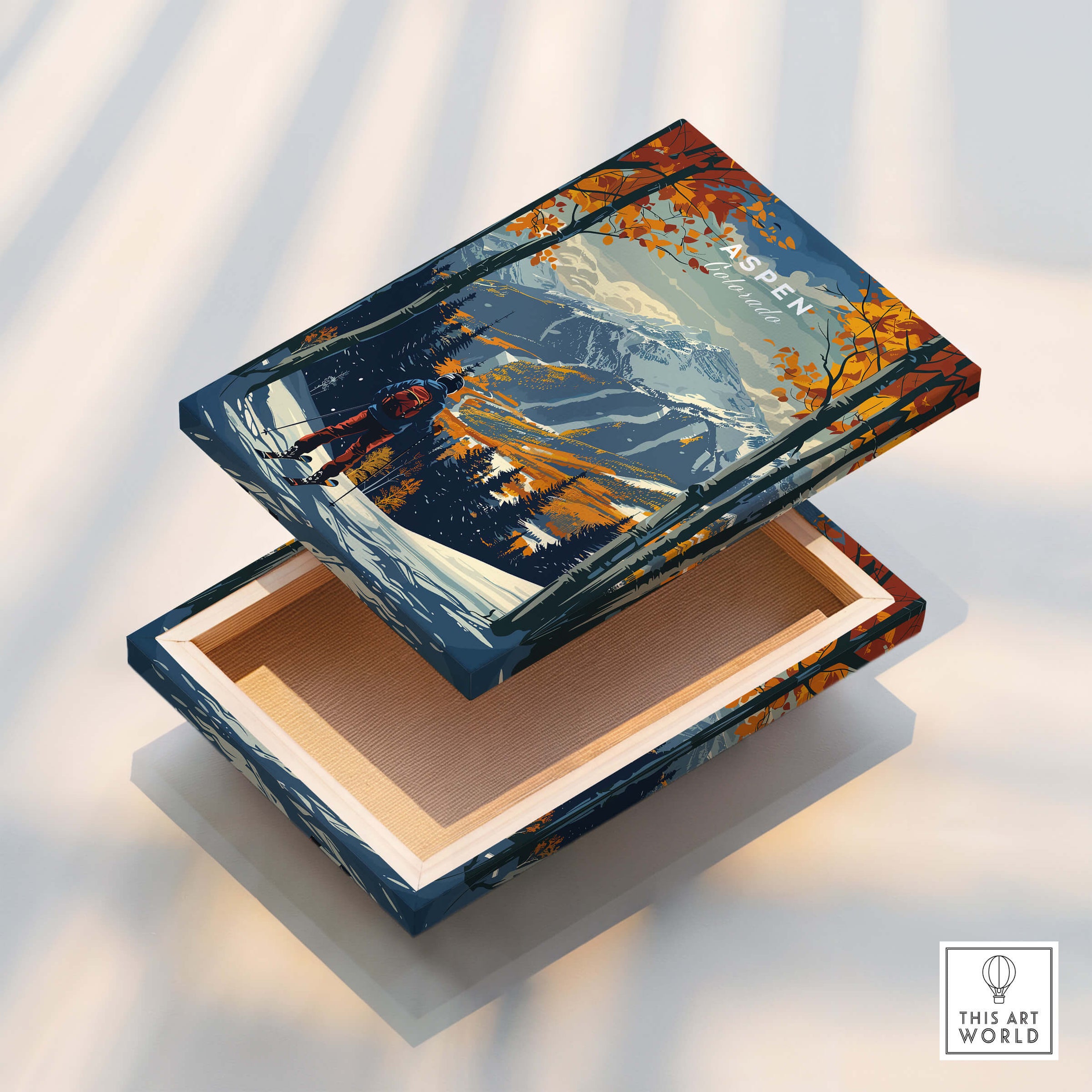 Aspen Print Ski Poster showing vibrant design of mountain landscape and autumn foliage on a decorative box.