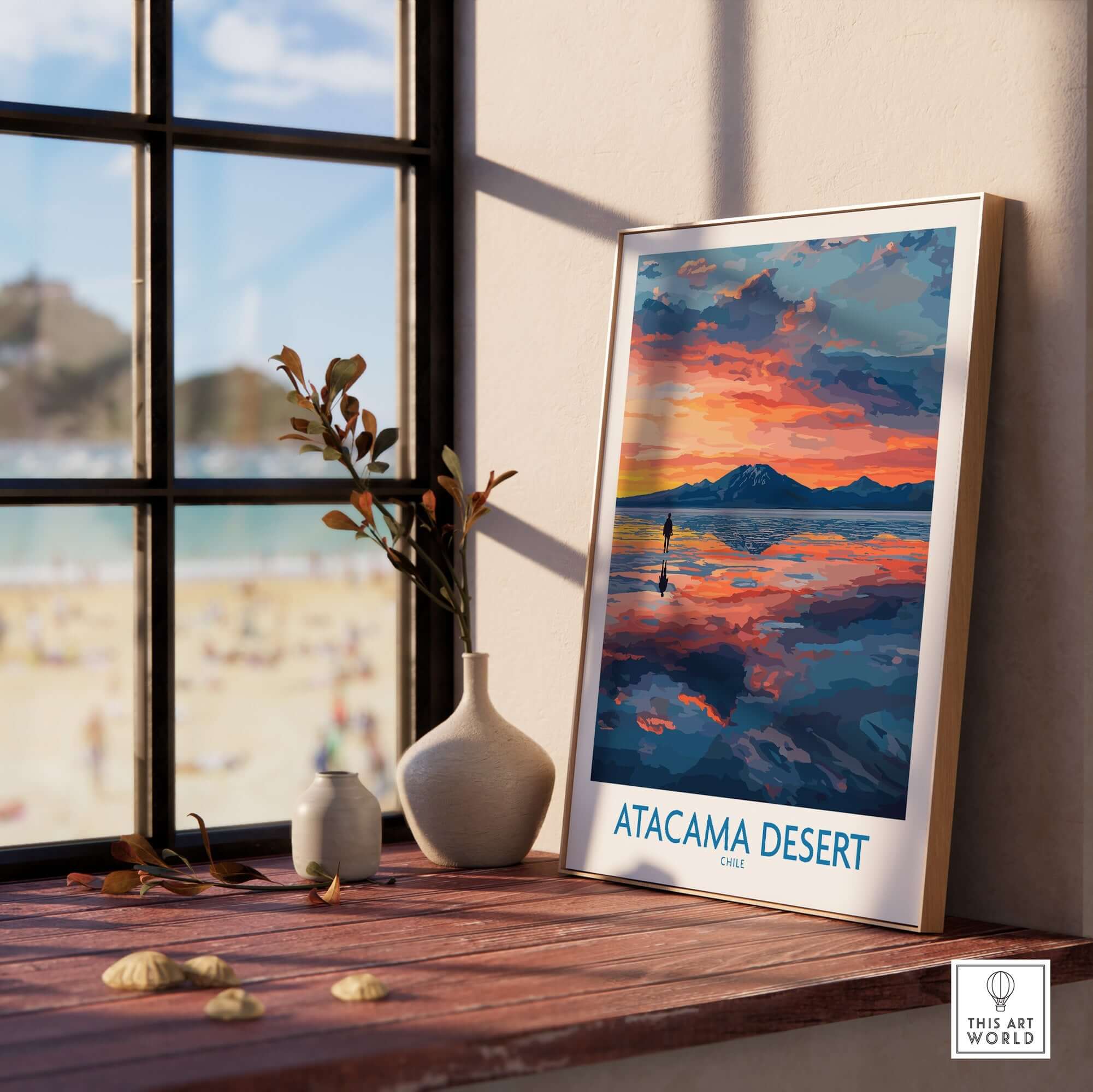 Atacama Desert Art Print - Sunset Scene displayed on a wooden shelf next to a vase and framed by a window.