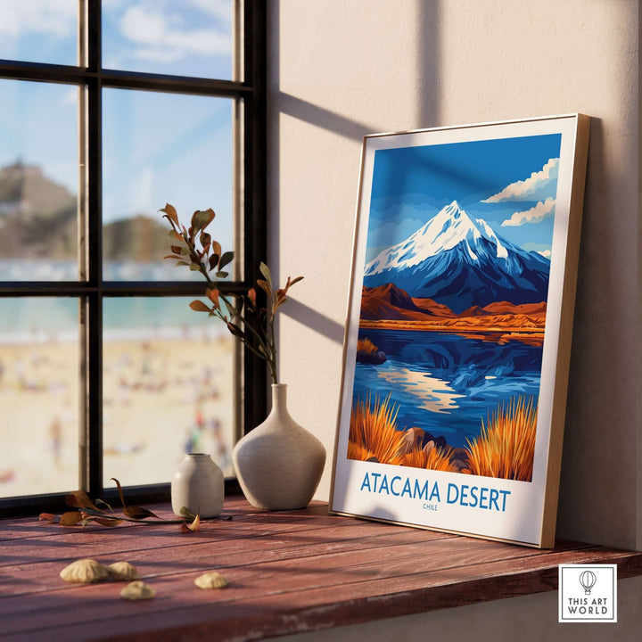 Atacama Desert Chile travel poster featuring vibrant mountains and serene water reflection, displayed indoors.