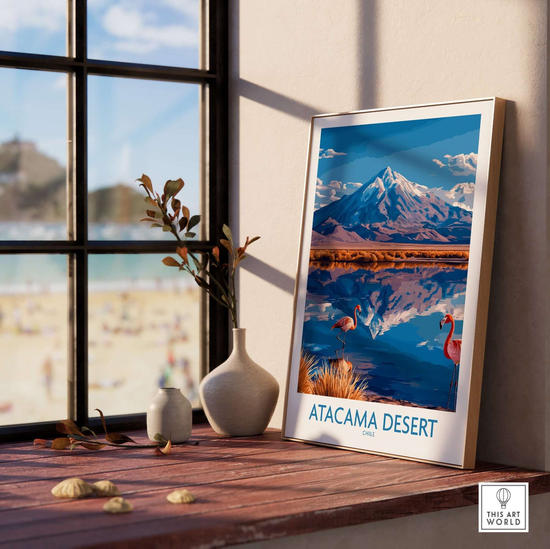 Atacama Desert poster featuring vibrant flamingos and a mountain reflection, displayed in a cozy room setting.