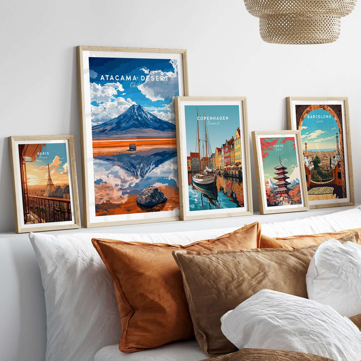 Atacama Desert travel print showcased among other city prints on a stylish bed, adding vibrant color to home decor.