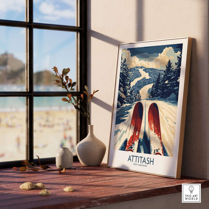 Attitash Ski Poster displayed on a wooden table with plants and a beach view in the background, capturing the essence of skiing.