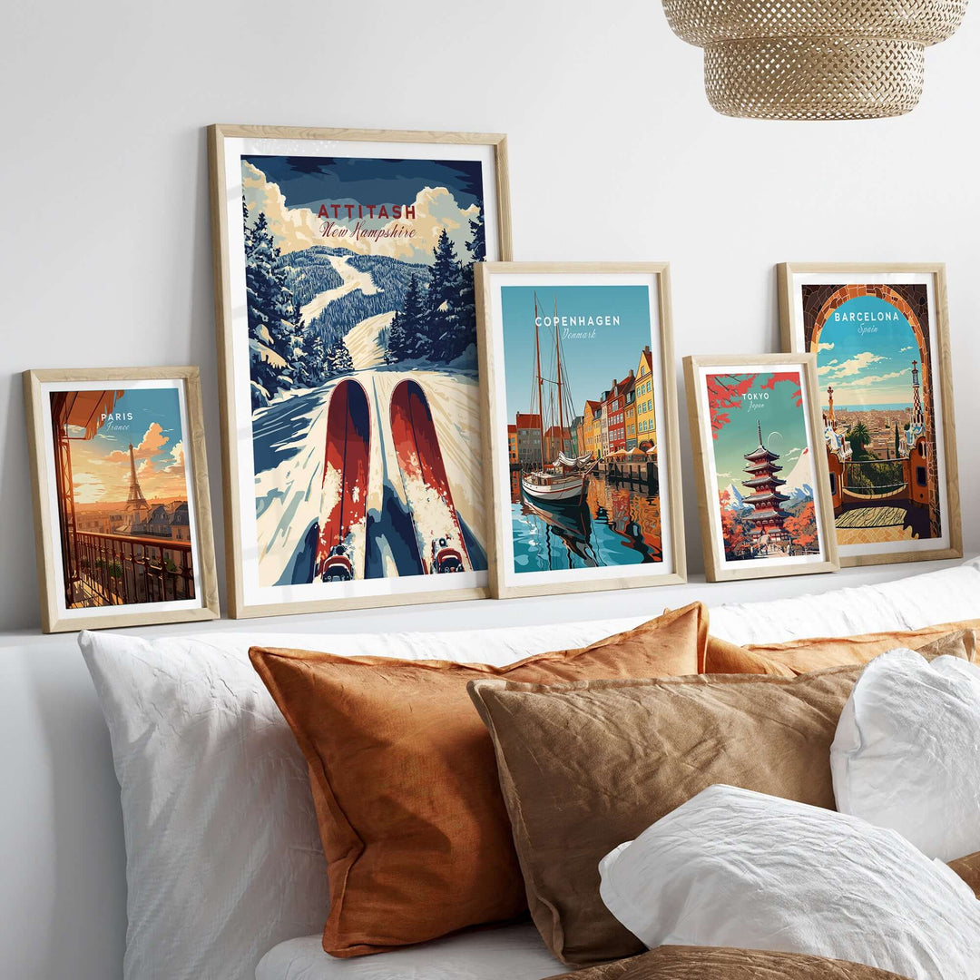 Stylish display of travel-themed prints including Attitash Ski Print on a cozy bed with decorative pillows.